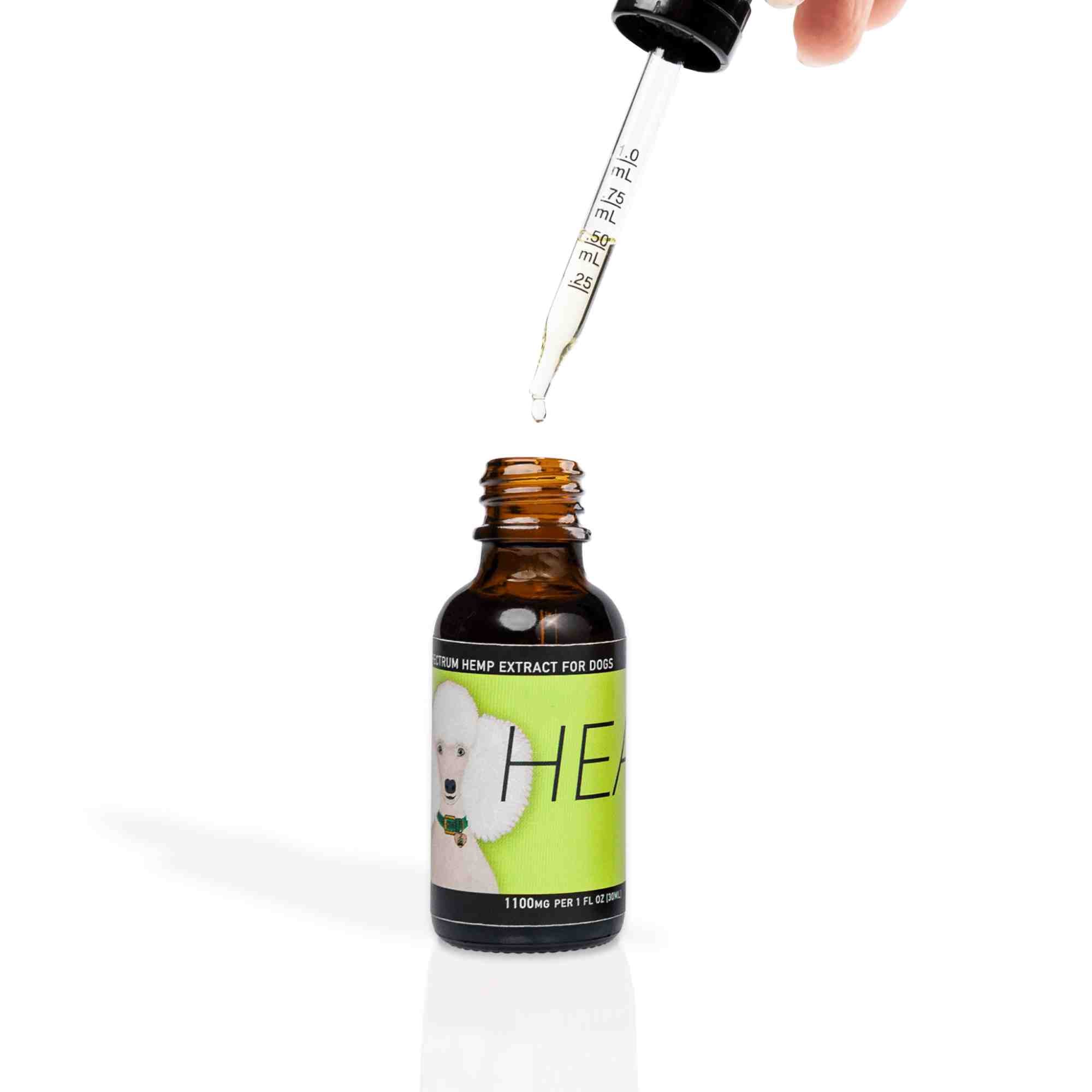Heal - Full Spectrum Hemp Extract Oil - front of bottle 1 fl oz bottle 1100mg with pipette out of bottle to show what the oil looks like it
